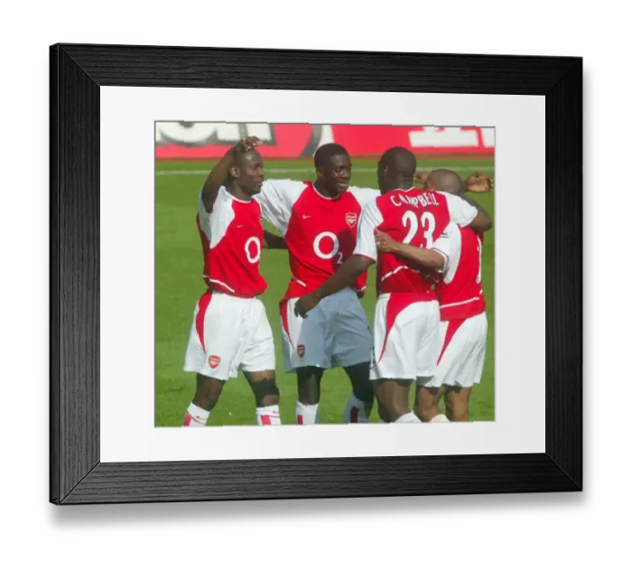 Framed Print : (L>R) Lauren, Kolo Toure, Sol Campbell and Ashley Cole celebrate at the end of the match