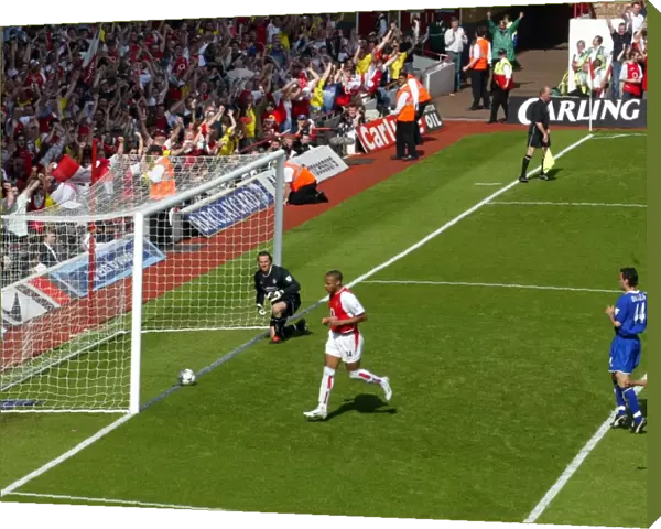 Thierry Henry celebrates scoring for Arsenal from the penalty spot