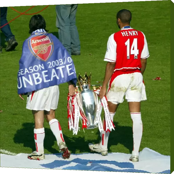 Robert Pires and Thierry Henry with the Premiership trophy