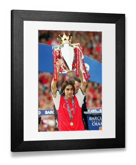 Framed Print : Robert Pires lifts the F. A. Barclaycard Premiership Trophy