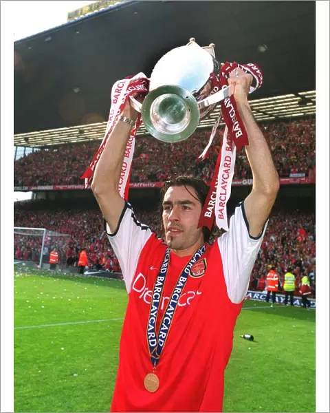Robert Pires with the F. A. Barclaycard Premiership Trophy