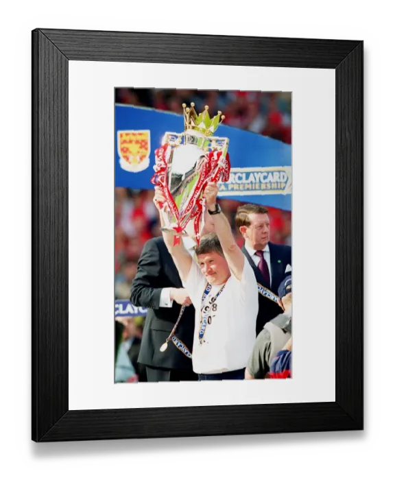 Framed Print : Assistant manager Pat Rice lifts the F. A. Barclaycard Premiership Trophy