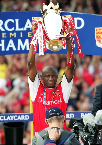 Patrick Vieira lifts the Premiership trophy after the match