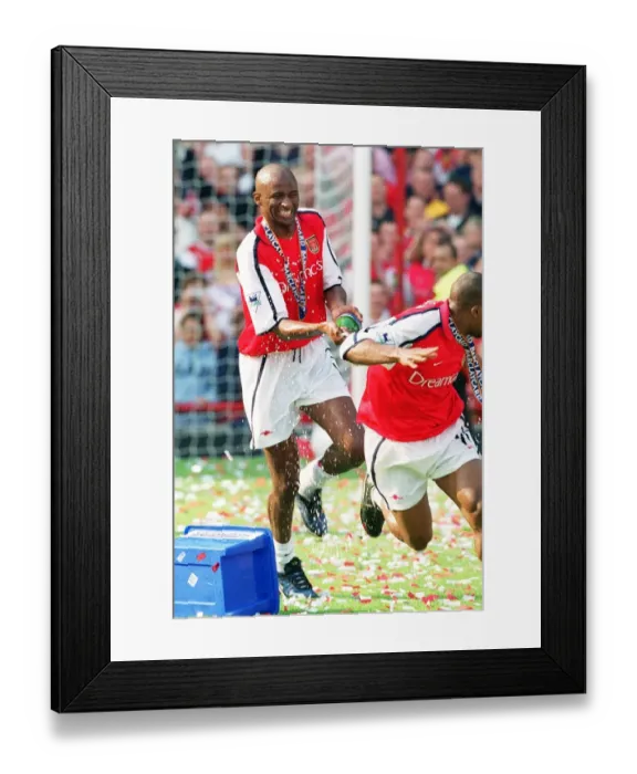 Framed Print : Patrick Vieira (Arsenal) celebrates after the match with Sylvain Wiltord Framed Print : Patrick Vieira (Arsenal) celebrates after the match with Sylvain Wiltord
