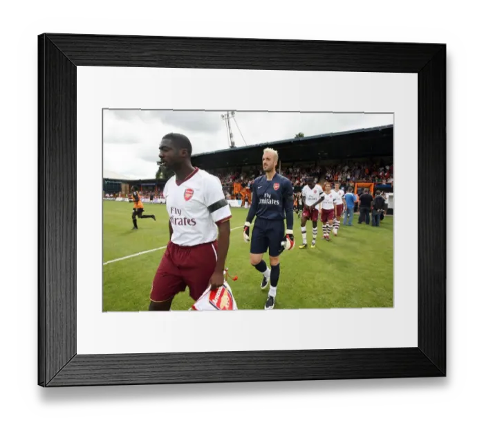 Framed Print : Kolo Toure and Manuel Almunia (Arsenal) lead the team out