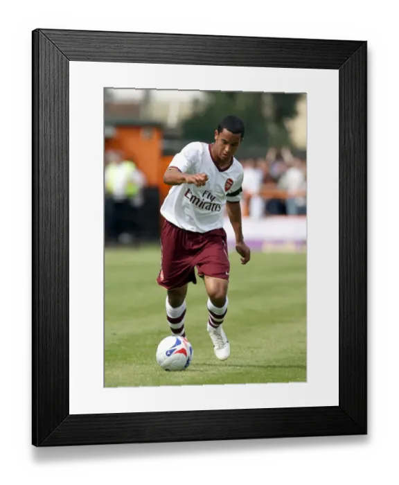 Framed Print : Theo Walcott's Debut: Arsenal Overpowers Barnet 2-0 in Pre-Season Friendly