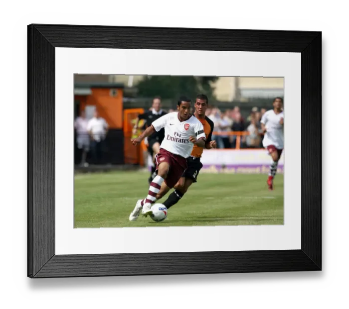 Framed Print : Theo Walcott (Arsenal) Nicky Nicolau (Barnet) Framed Print : Theo Walcott (Arsenal) Nicky Nicolau (Barnet)