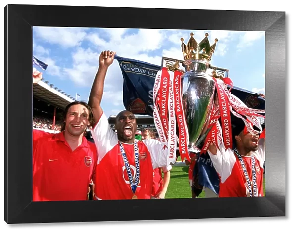 Rami Shaaban, Sol Campbell and Ashley Cole with the Premiership Trophy