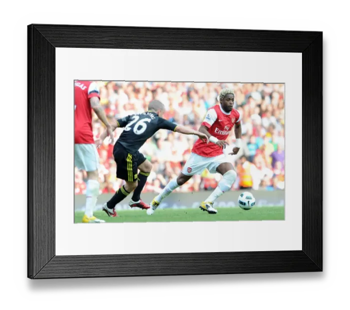 Framed Print : Alex Song (Arsenal) Jay Spearing (Liverpool). Arsenal 1: 1 Liverpool. Barclays Premier League Framed Print : Alex Song (Arsenal) Jay Spearing (Liverpool). Arsenal 1: 1 Liverpool. Barclays Premier League