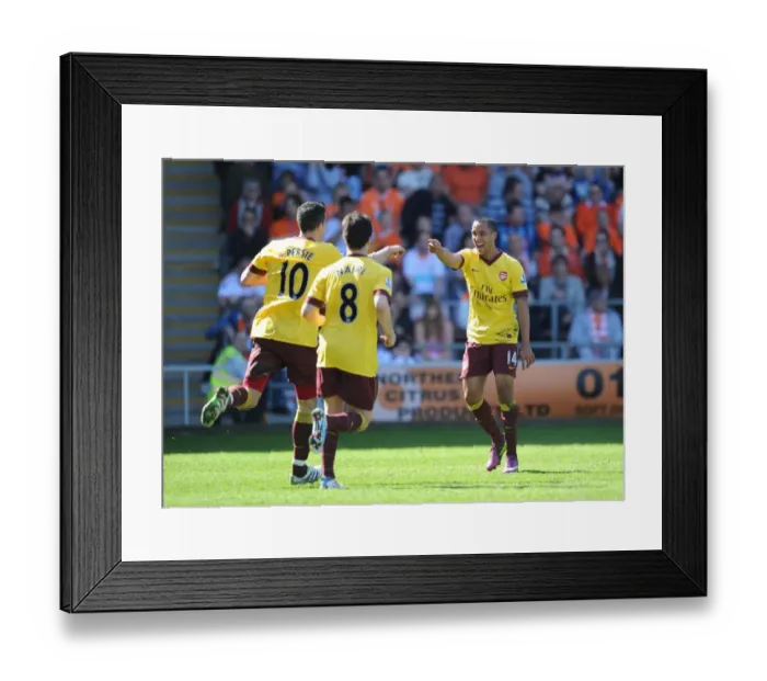 Framed Print : Robin van Persie's Stunner: Theo Walcott and Samir Nasri Celebrate Arsenal's 3-1 Win Over Blackpool