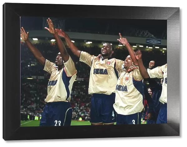 Patrick Vieira, Ashley Cole, Lauren and Sol Campbell celebrate the Arsenal Championship victory afte