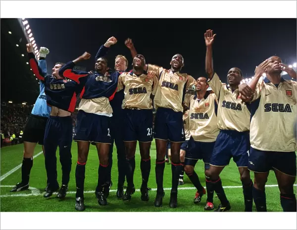 The Arsenal team celebrate the Championship victory after the match