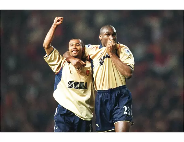 Glory Days: Sol Campbell and Ashley Cole Celebrate Arsenal's Championship Win at Old Trafford, 2002
