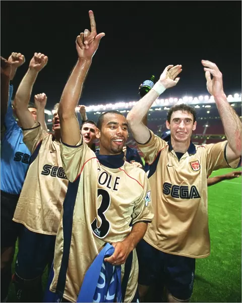 Ashley Cole and Martin Keown celebrate the Arsenal Championship victory after the match