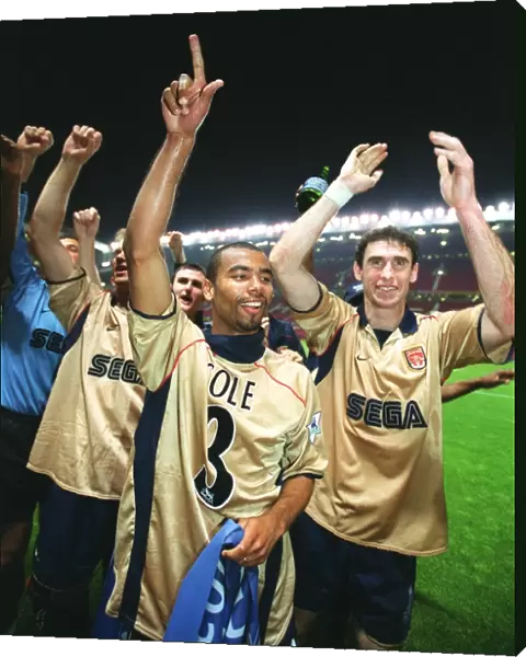 Ashley Cole and Martin Keown celebrate the Arsenal Championship victory after the match