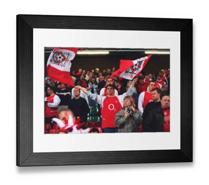 Framed Print : Arsenal fan with flags before the match. Arsenal 1: 0 Southampton. The F Framed Print : Arsenal fan with flags before the match. Arsenal 1: 0 Southampton. The F
