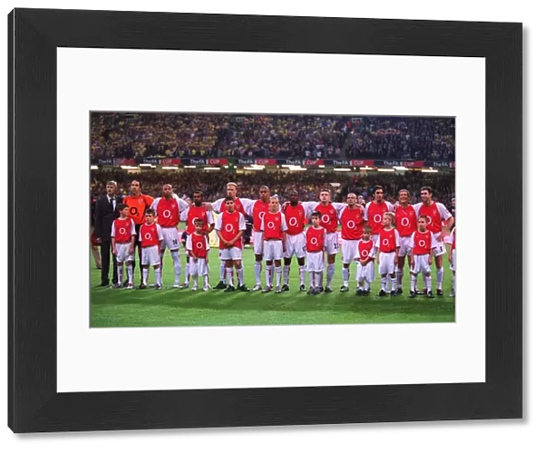The Arsenal players and Manager Arsene Wenger line up before the match