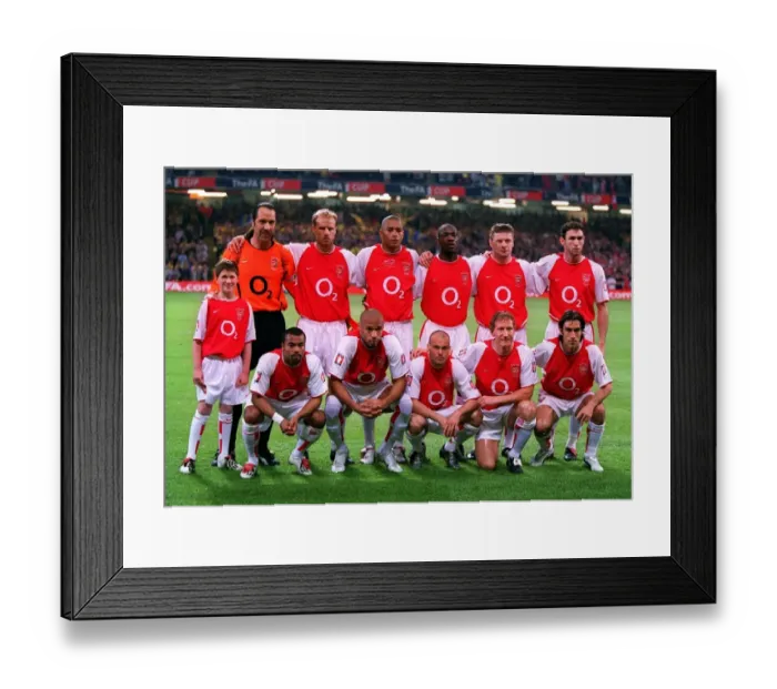 Framed Print : The Arsenal team with mascot Jude Smith before the match