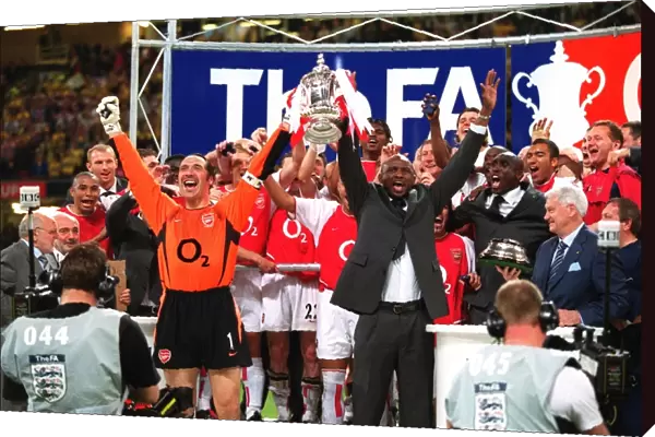 Arsenal captain Patrick Vieira and vice-captain David Seaman lift the FA Cup