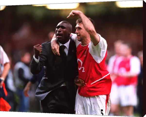 Sol Campbell and Martin Keown celebrate after the match