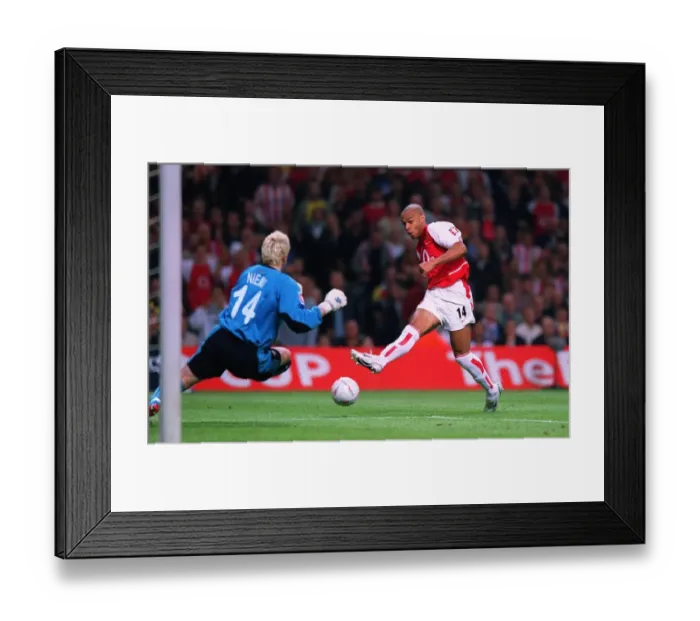 Framed Print : Thierry Henry (Arsenal) has his shoot blocked by Anti Niemi (Southampton) Framed Print : Thierry Henry (Arsenal) has his shoot blocked by Anti Niemi (Southampton)