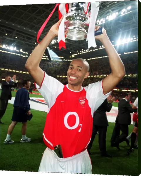 Thierry Henry with the FA Cup after the match