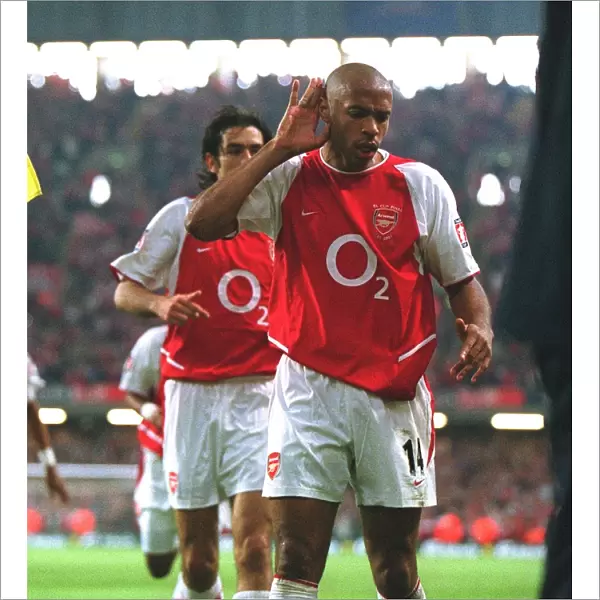 Robert Pires celebrates scoring the Arsenal goal with Thierry Henry
