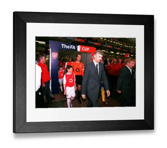 Framed Print : Arsene Wenger the Arsenal Manager leads to team out onto the pitch