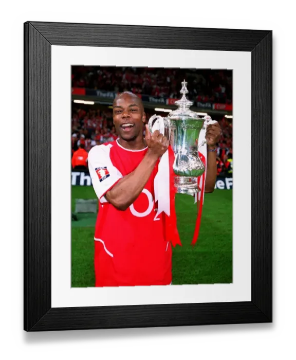 Framed Print : Arsenal's FA Cup Victory: Sylvain Wiltord Lifts the Trophy over Southampton (May 17, 2003)