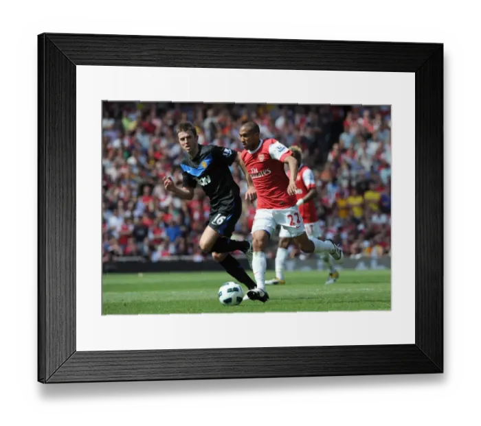 Framed Print : Gael Clichy (Arsenal) Michael Carrick (Man Utd). Arsenal 1: 0 Manchester United Framed Print : Gael Clichy (Arsenal) Michael Carrick (Man Utd). Arsenal 1: 0 Manchester United