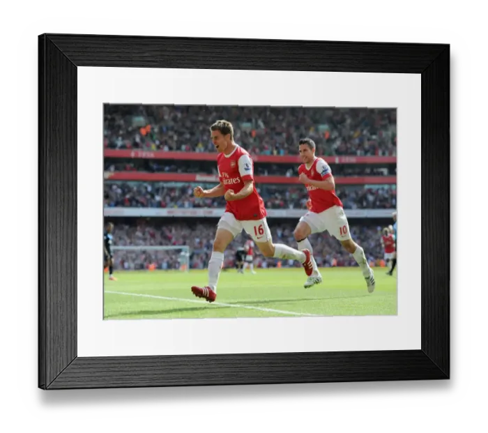 Framed Print : Unstoppable Partnership: Ramsey and van Persie's 1-0 Victory Over Manchester United