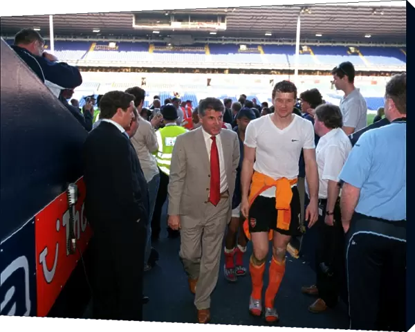 Arsenal Vice Chairman David dein and Jens Lehmann walk up the tunnell at the end of the match