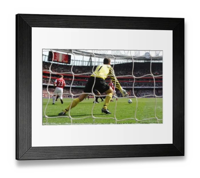 Framed Print : Aaron Ramsey shoots past Man United goalkeeper Edwin van der Sar to score the Arsenal goal Framed Print : Aaron Ramsey shoots past Man United goalkeeper Edwin van der Sar to score the Arsenal goal