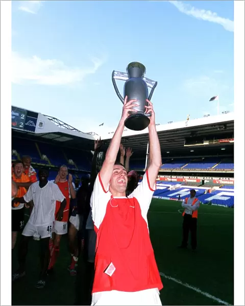 Edu (Arsenal) celebrates winning the League with an inflatable trophy