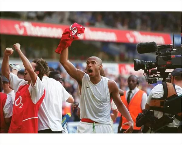 Thierry Henry's Euphoric Celebration: Arsenal Clinch the Premier League Title at White Hart Lane (2004)