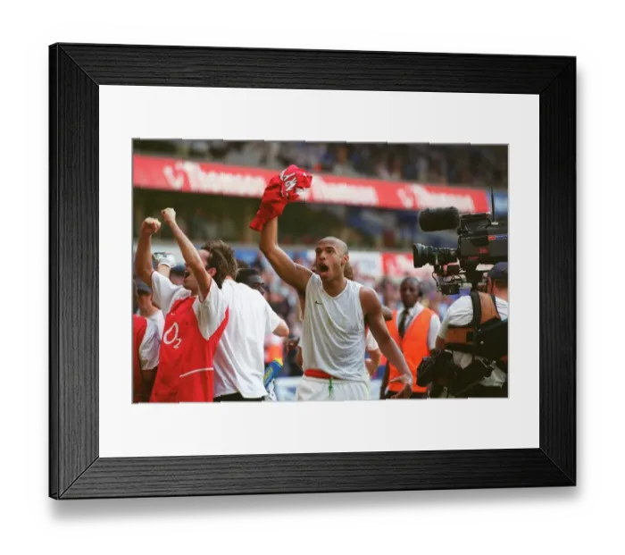 Framed Print : Thierry Henry's Euphoric Celebration: Arsenal Clinch the Premier League Title at White Hart Lane (2004)
