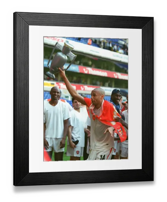 Framed Print : Thierry Henry's Glory: Arsenal Clinch the Premier League Title at White Hart Lane (2004)