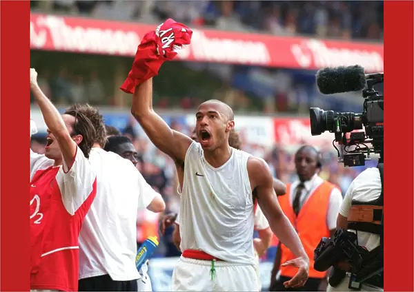 Thierry Henry's Glory: Arsenal's Premier League Victory Celebration at White Hart Lane, 2004