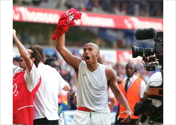 Thierry Henry's Glory: Arsenal's Premier League Victory Celebration at White Hart Lane, 2004