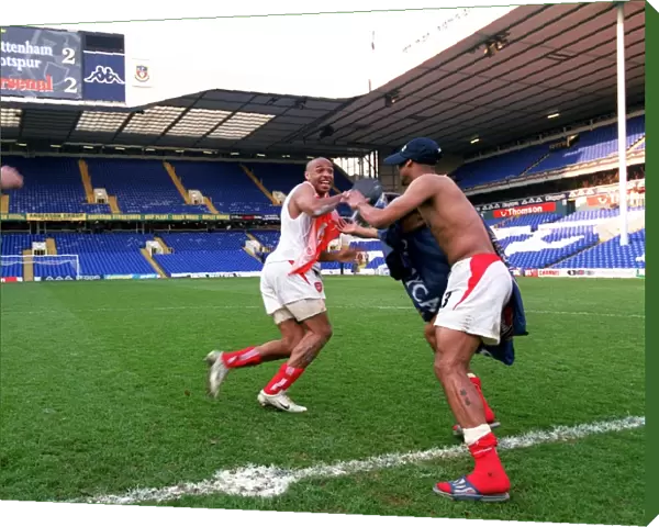 Thierry Henry and Ashley Cole celebrate at the end of the match