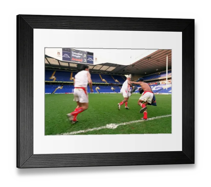 Framed Print : Thierry Henry runs off with the inflatable trophy followed by Robert Pires Framed Print : Thierry Henry runs off with the inflatable trophy followed by Robert Pires