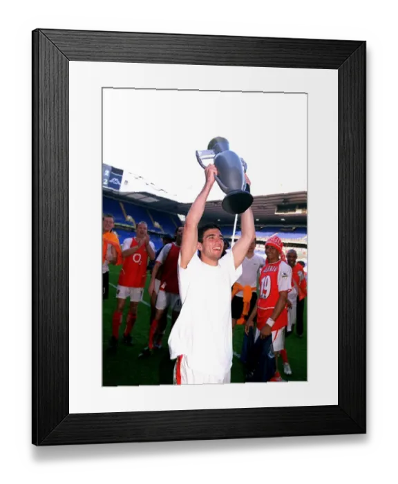 Framed Print : Jose Reyes (Arsenal) celebrates winning the League with an inflatable trophy Framed Print : Jose Reyes (Arsenal) celebrates winning the League with an inflatable trophy