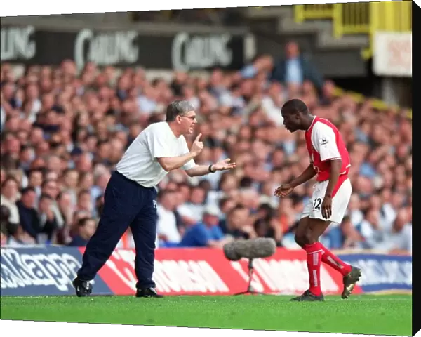 Pat Rice give Lauren instructions during the match. Tottenham Hotsour v Arsenal