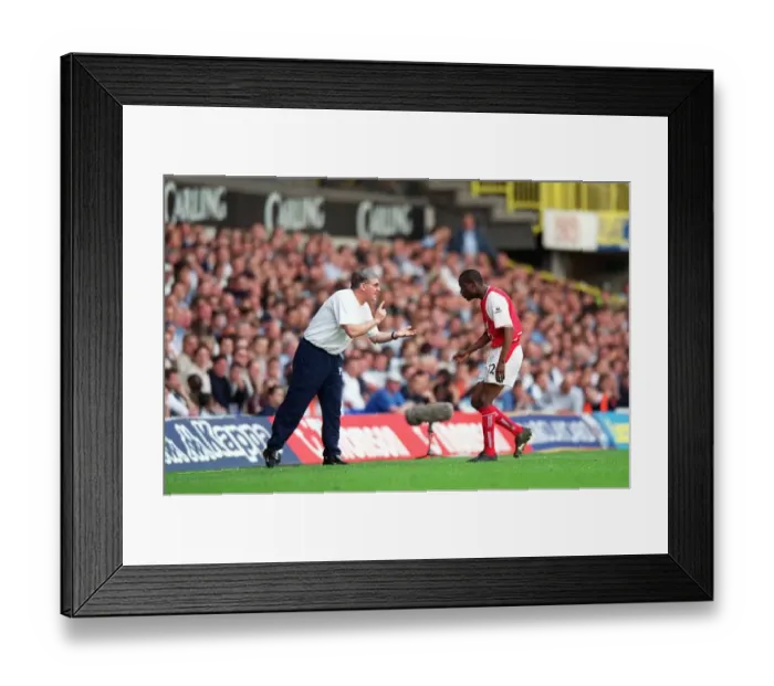 Framed Print : Pat Rice give Lauren instructions during the match. Tottenham Hotsour v Arsenal Framed Print : Pat Rice give Lauren instructions during the match. Tottenham Hotsour v Arsenal