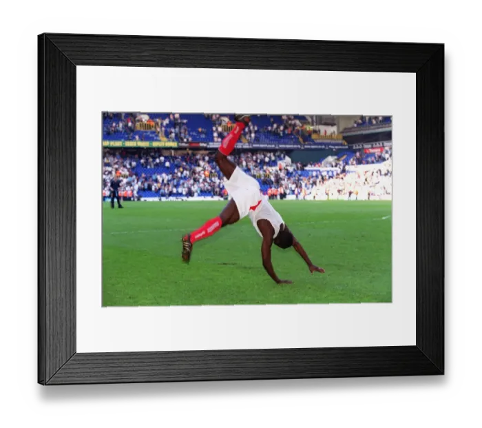 Framed Print : Kolo Toure celebrates by performing a back flip. Tottenham Hotspur v Arsenal