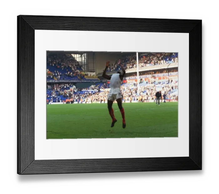 Framed Print : Kolo Toure celebrates by performing a back flip across the pitch