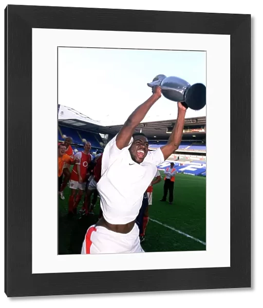 Arsenal's Kolo Toure Celebrates Premier League Victory with Inflatable Trophy at White Hart Lane
