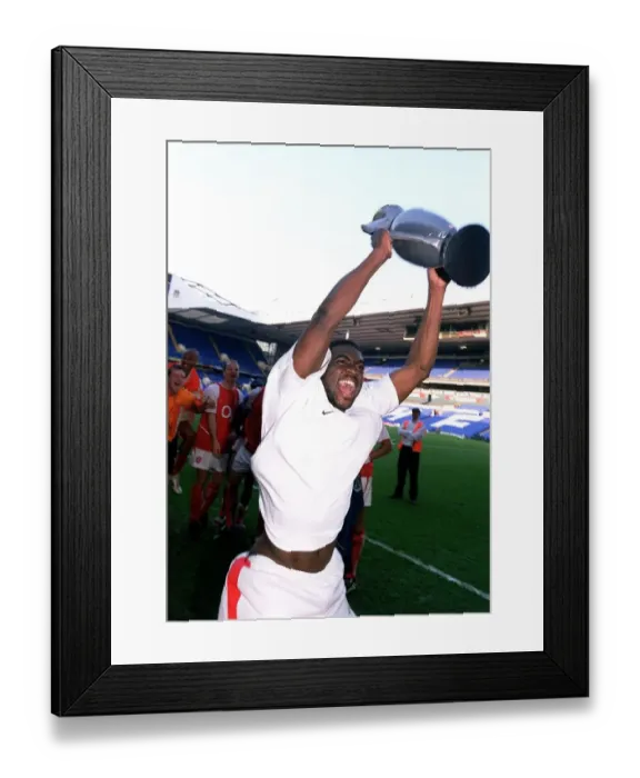 Framed Print : Arsenal's Kolo Toure Celebrates Premier League Victory with Inflatable Trophy at White Hart Lane