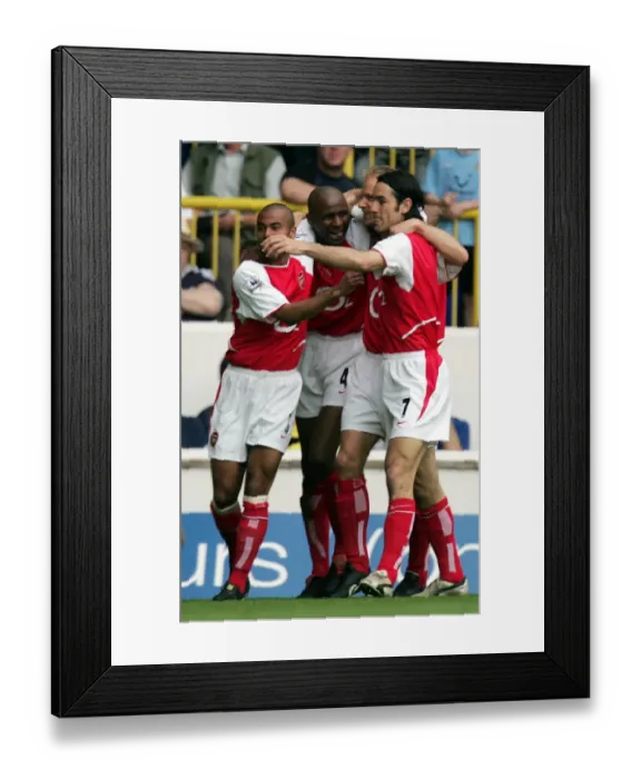 Framed Print : Unforgettable Rivalry: Vieira and Pires Euphoric Goal Celebration at White Hart Lane, 2004 Framed Print : Unforgettable Rivalry: Vieira and Pires Euphoric Goal Celebration at White Hart Lane, 2004