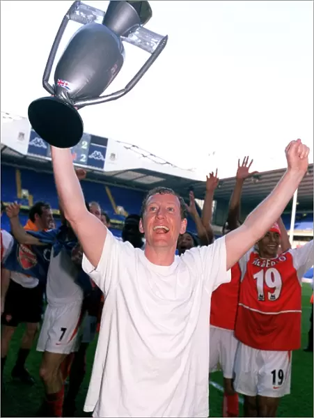 Ray Parlour's Triumph: Arsenal's League Victory Celebration at White Hart Lane, 2004